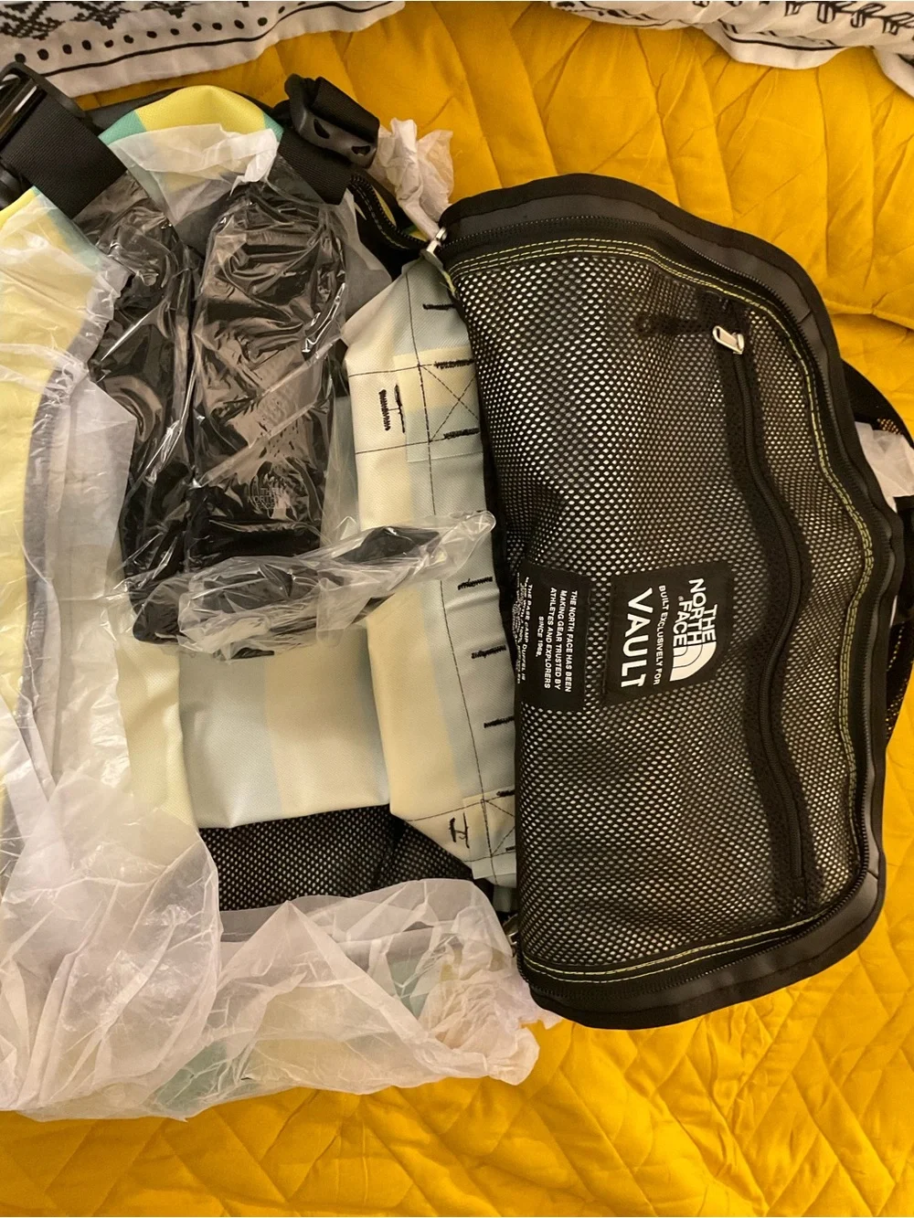 The North Face Yellow & Teal Striped Duffel Bag